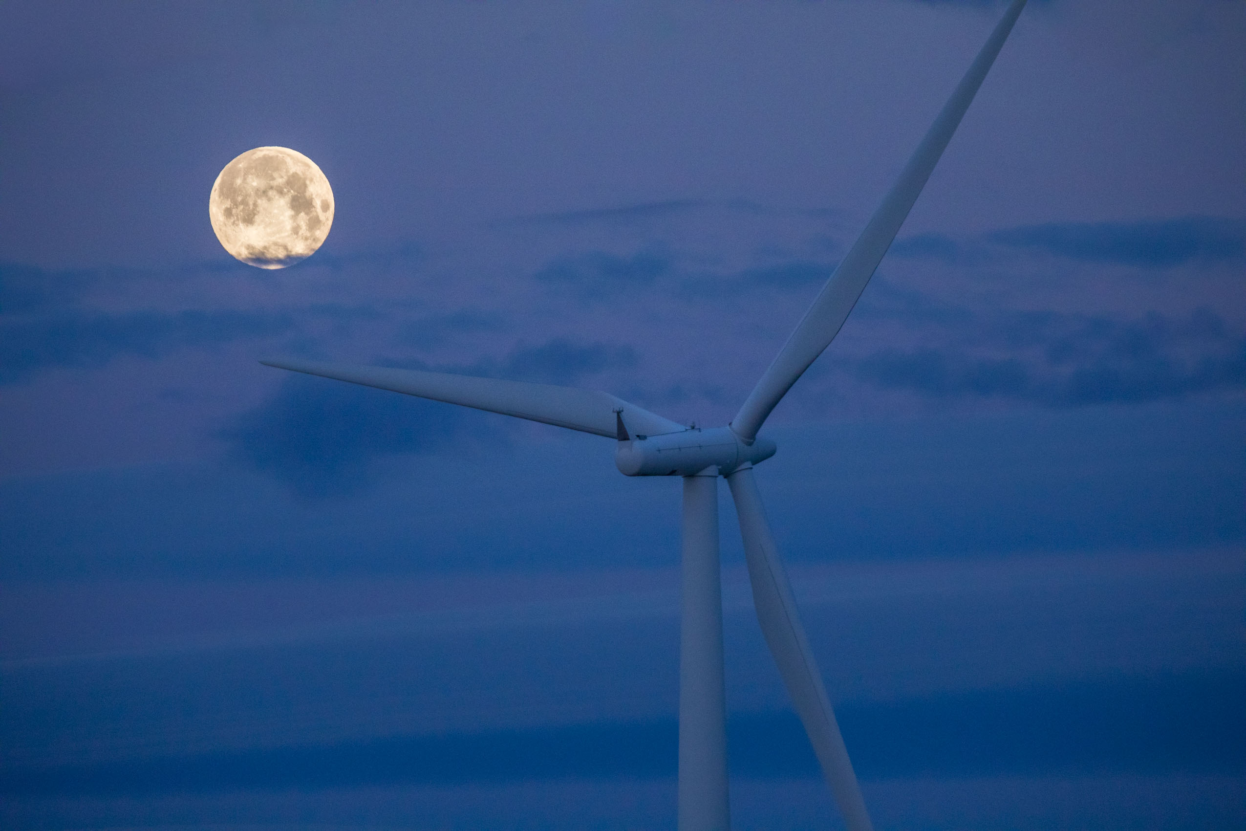 wind energy turbine with blue moon 
