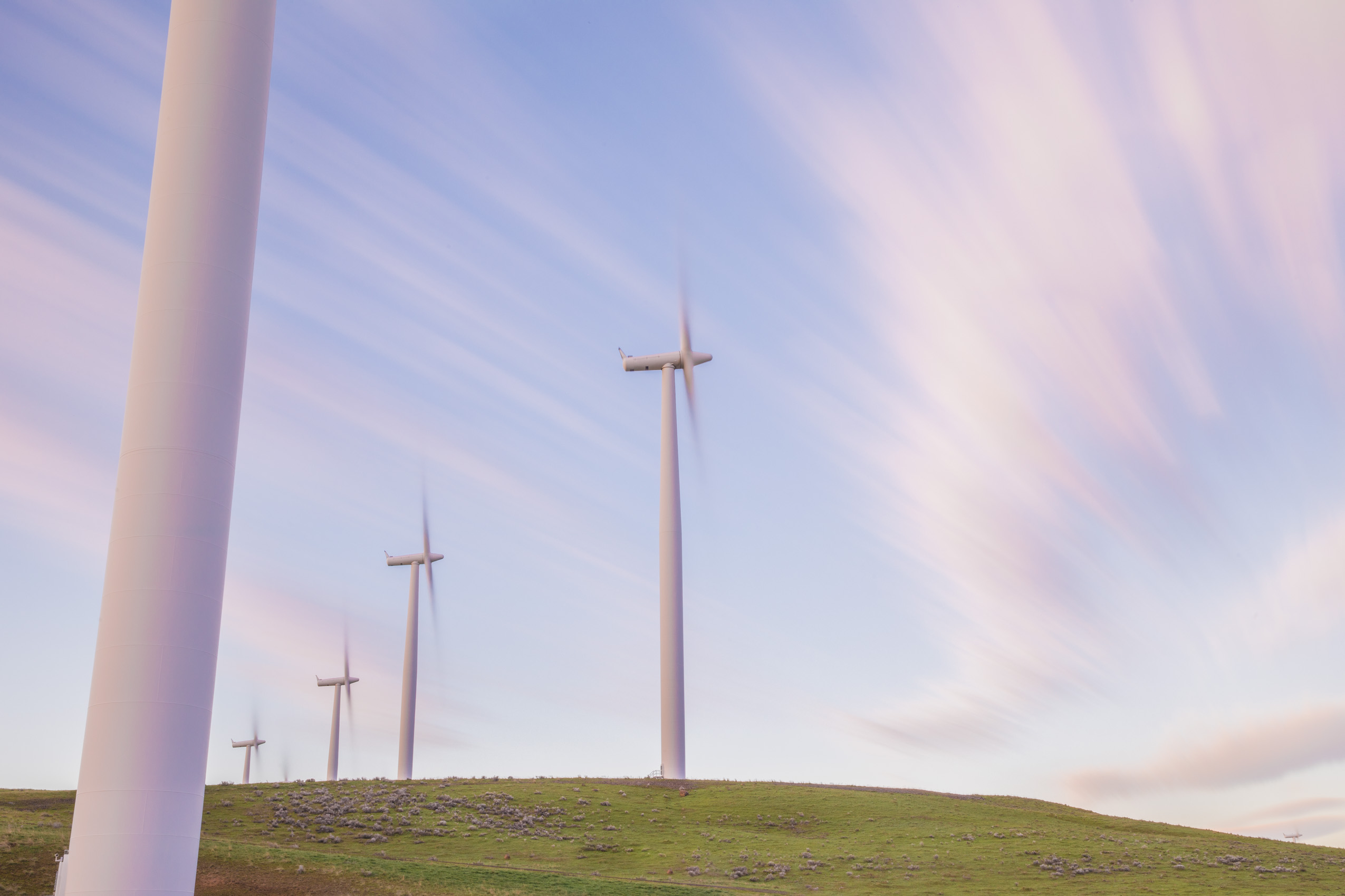 Renewable energy wind farm, wind turbines at sunrise by photographer Rich Crowder 