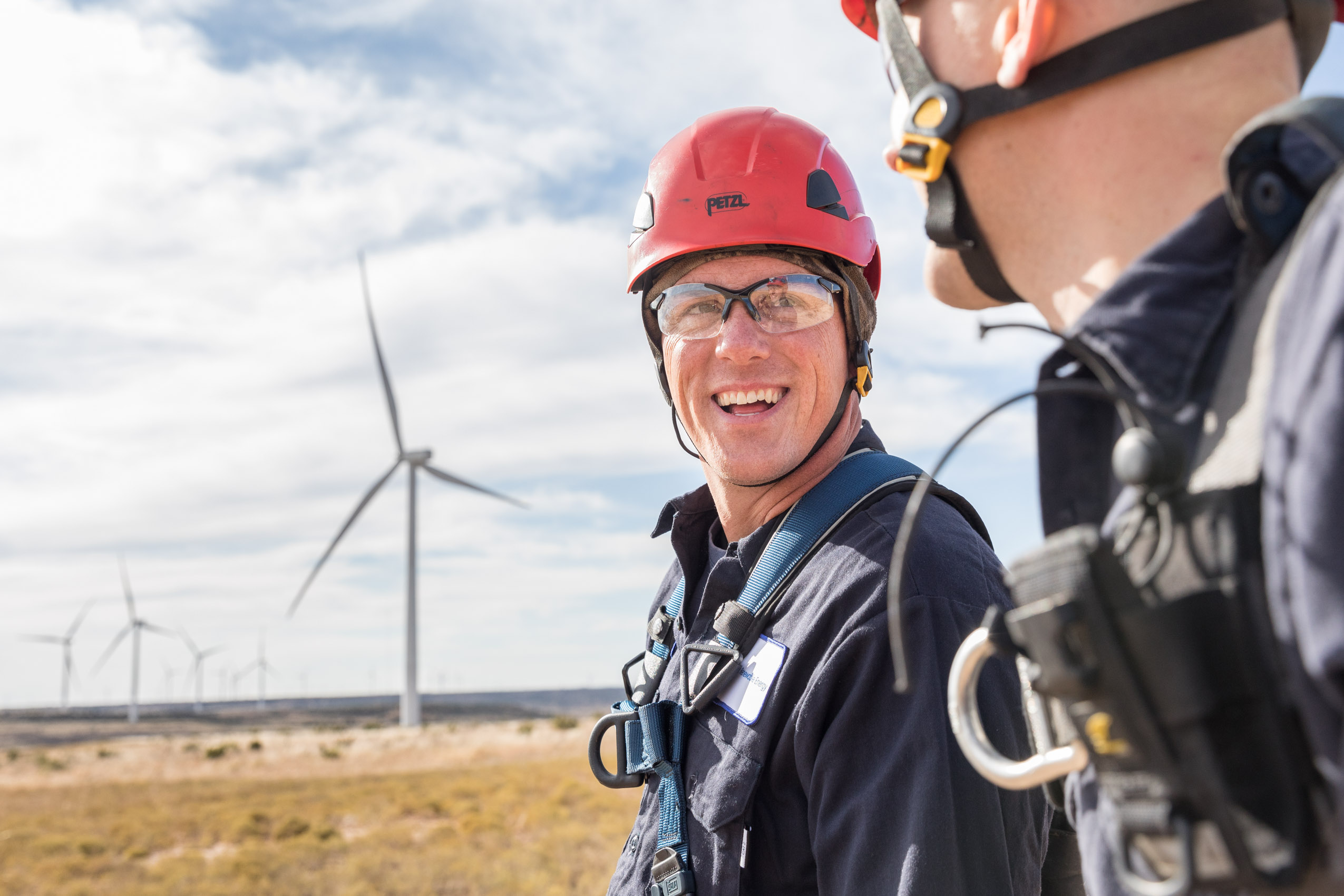 wind technician smiling on texas wind farm