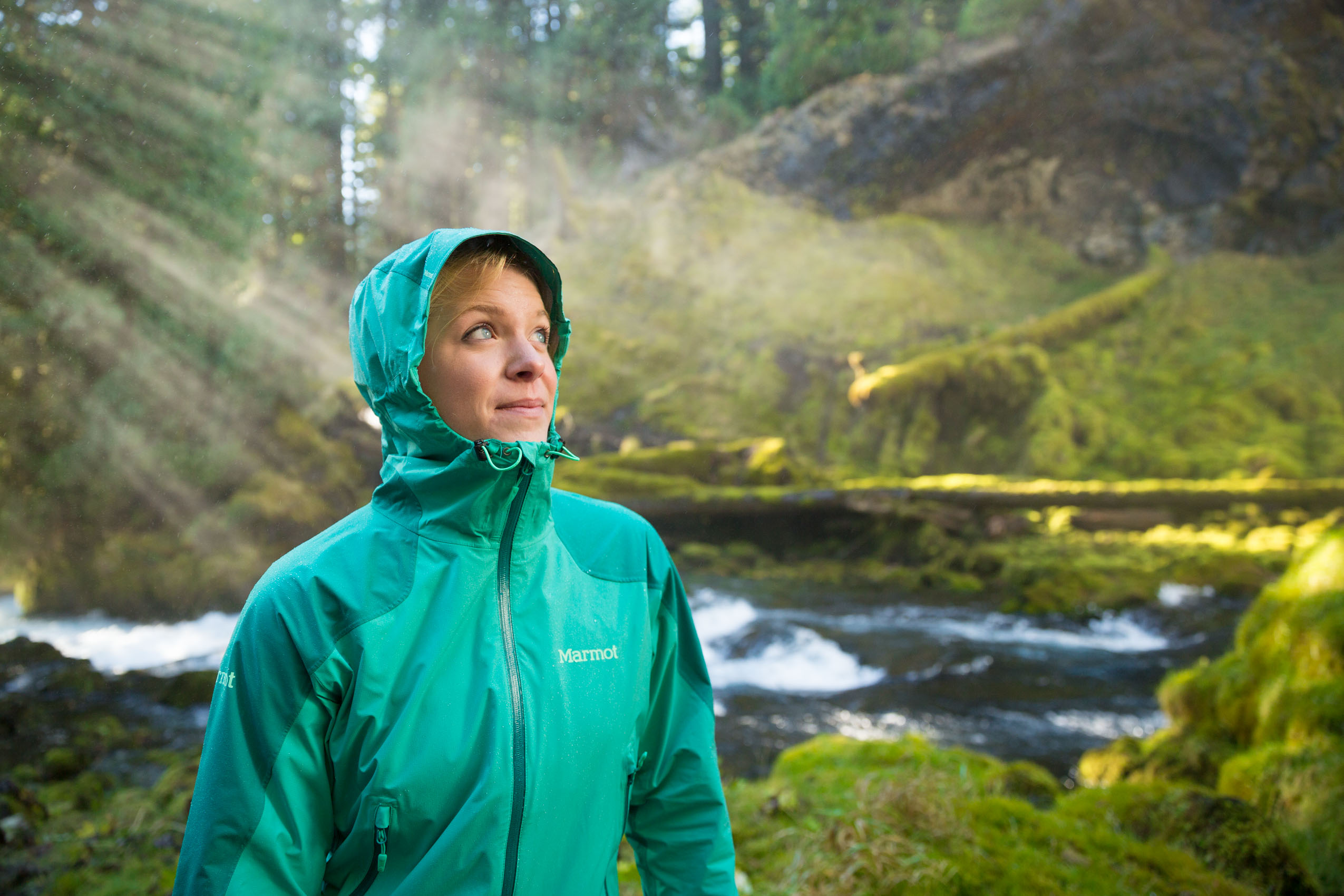 female hiker with backlit waterfall Photographer Rich Crowder