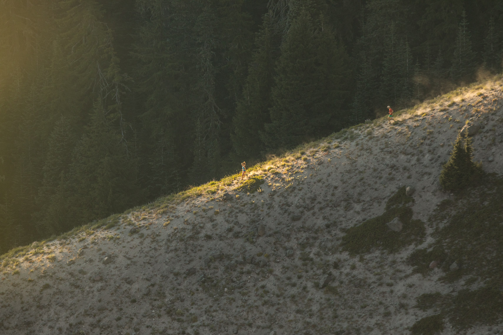 trail running mountains at sunrise on ridge by adventure photographer Rich Crowder