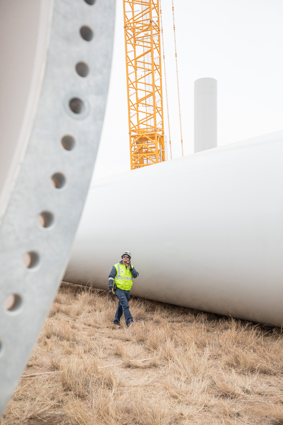 Wind turbine farm being build minimalist photography by Rich Crowder