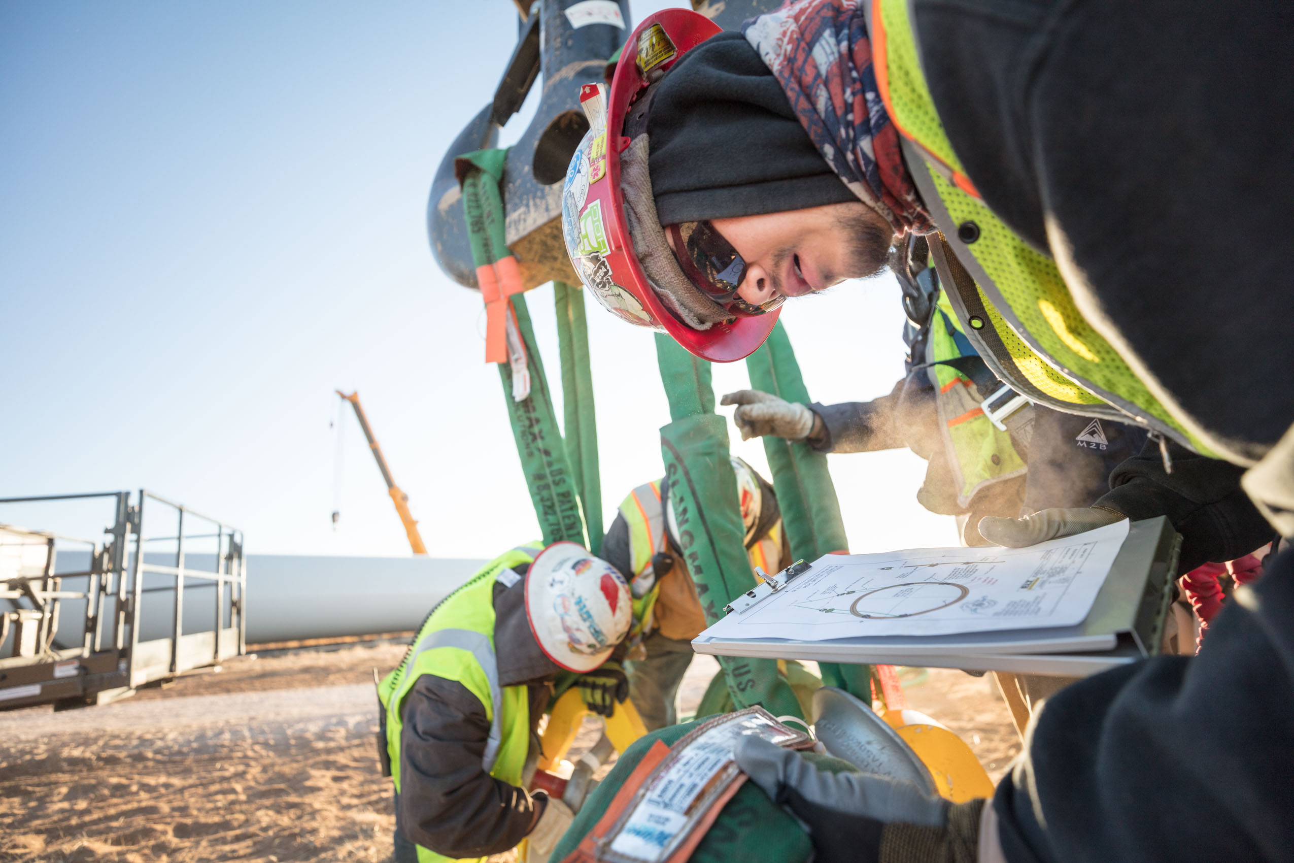 reviewing plans for wind turbine