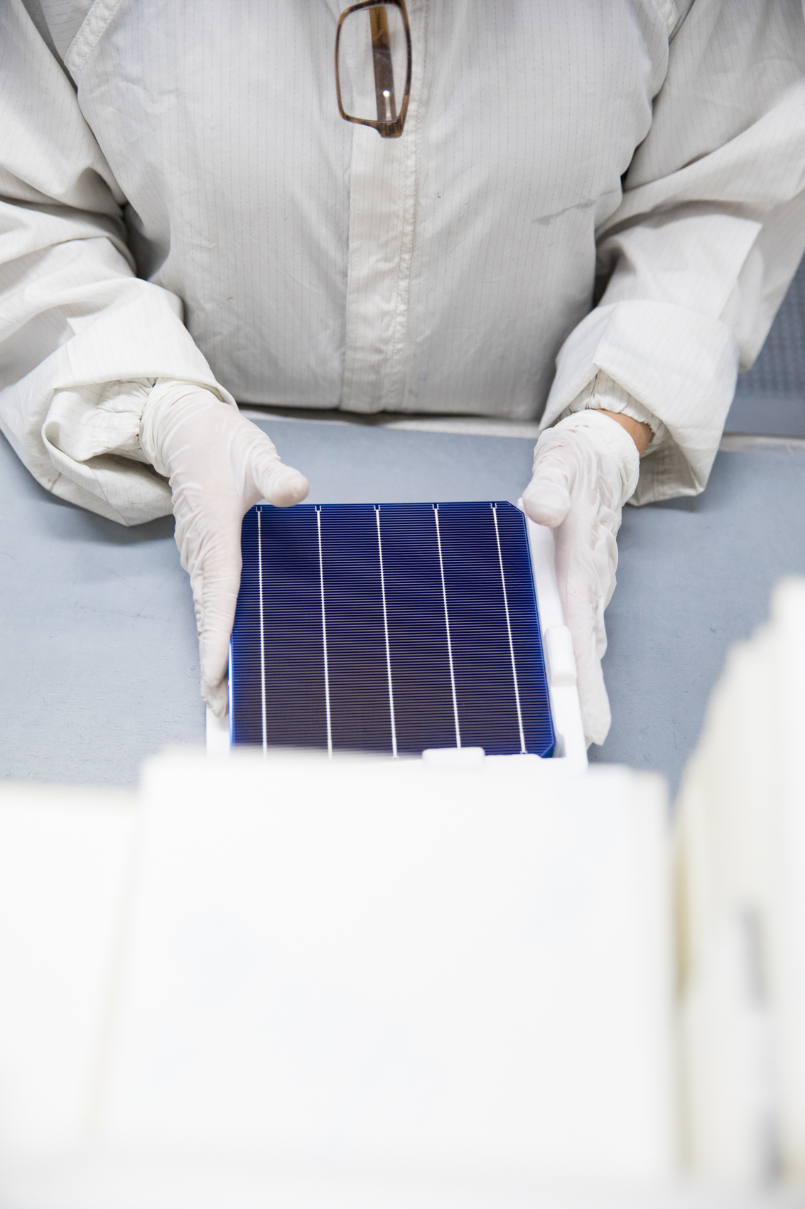 hands inspecting solar cells renewables photographer Rich Crowder